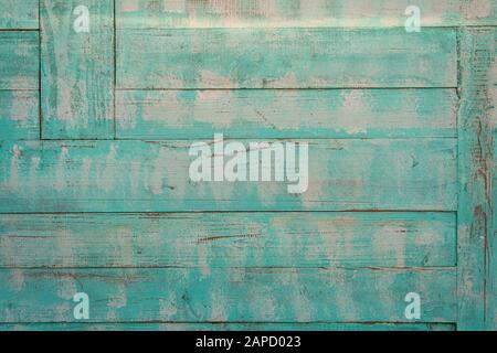 distressed wooden planks, pastel green paint. Stock Photo