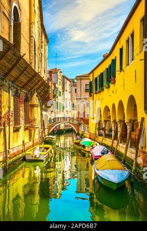 Venice cityscape, water canal, bridge, colonnade and traditional buildings. Veneto region, Italy, Europe. Stock Photo