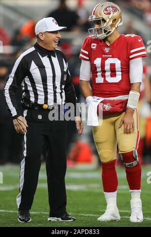 NFL referee John Hussey (35) chats with San Francisco 49ers quarterback Jimmy Garoppolo (10) during the NFL football NFC Championship game, Sunday, Jan. 19, 2020, in Santa Clara, Calif. The 49ers defeated the Packers 37-20 to advance to the Super Bowl. (Photo by IOS/ESPA-Images) Stock Photo