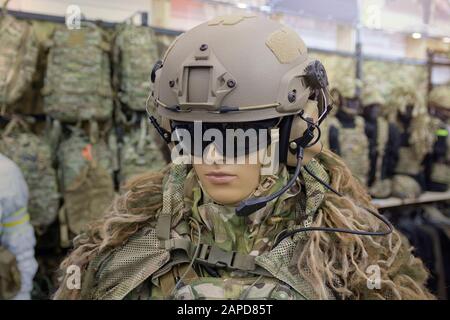 Mannequin in army helmet and camouflage gear. Weaponry Stock Photo