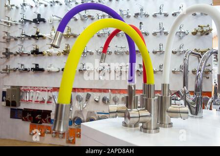 Rows of new faucets in plumbing shop, closeup Stock Photo