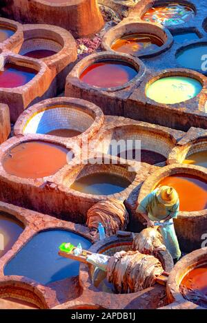 Leather dying in a traditional tannery in the city Fes, Morocco Stock Photo