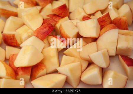 juicy fresh local apples on a cutting board have been cut and sliced up Stock Photo