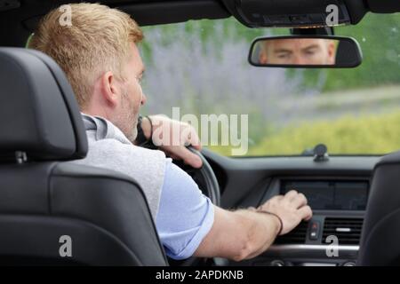 man sets up air conditioning Stock Photo