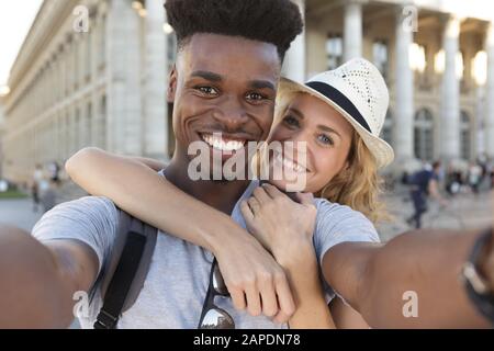 lovely mixed couple making a selfie Stock Photo