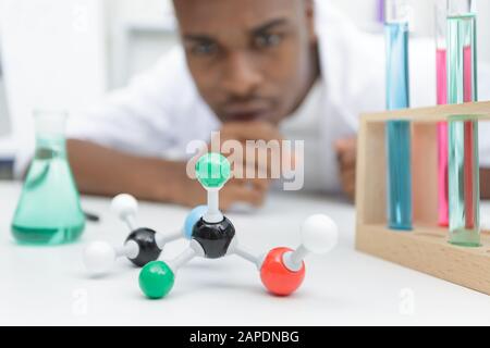 scientist examining dna model in laboratory Stock Photo