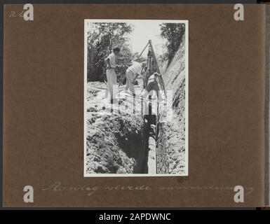 Photo album Deli Maatschappij: Water pipe Maatschappij Ajer Beresih, Sumatra 1952-1953 Description: Workers at work in the construction of the fourth supply pipe Annotation: Water pipe Maatschappij Ajer Beresih N.V. was a subsidiary of the Deli Maatschappij Date: 31 May 1954 Location: Indonesia, Lau Bengklewang, Sumatra Keywords: workers, irrigation, water supply companies, water purification Stock Photo