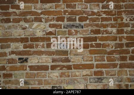 Closeup of a red stone wall - a nice picture for wallpapers and backgrounds Stock Photo