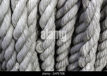Closeup of white ropes under the lights - a cool picture for backgrounds and wallpapers Stock Photo