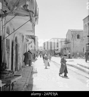 Israel 1964-1965: Jerusalem (Jerusalem), Mea Shearim Description: Busy in the streets of Mea Shearim Annotation: Mea Shearim, also called Meah Shearim or a hundred gates, is one of the oldest neighborhoods of Jerusalem. It was built from about 1870 by Hasidic Jews who lived in the Old Town until then. However, there was too little space and so they bought a piece of land northwest of the city. This land, a swamp area, was cultivated into land to build a new neighborhood: Meah Shearim. The district is known anno 2012 as the most extreme orthodox Jewish quarter in the world and is home to severa Stock Photo