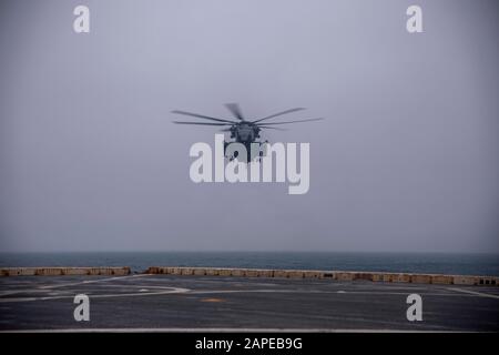 191217-N-GR168-1013 ATLANTIC OCEAN (Dec. 17, 2019) A CH-53E Super Stallion helicopter, assigned to the Blue Knights of Marine Medium Tiltrotor Squadron (VMM) 365 (Reinforced), lands on the flight deck of the amphibious transport dock ship USS New York (LPD 21), Dec. 17, 2019. New York is operating in the Atlantic Ocean in support of naval operations to maintain maritime stability and security in order to ensure access, deter aggression and defend U.S. allied and partner interests. (U.S. Navy photo by Mass Communication Specialist 2nd Class Lyle Wilkie/Released) Stock Photo