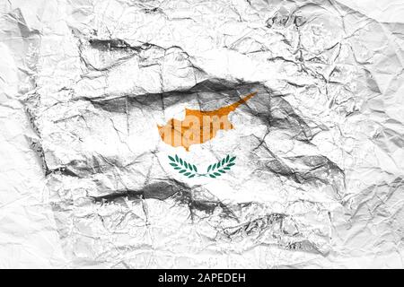 The national flag of the Cyprus is painted on crumpled paper. Flag printed on the sheet. Flag image for design on flyers, advertising. Stock Photo