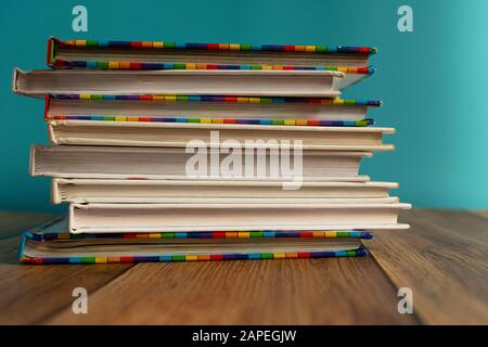 A stack of different bookmarks with bookmarks for pages. Book binding. Knowledge and education. Books for children. School library. Stock Photo