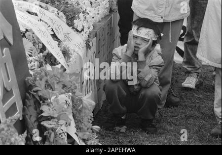 Demonstration and commemoration in The Hague for victims of the student uprising in China Description: Betoger sits squatting at commemoration plate Date: June 7, 1989 Location: The Hague, Zuid-Holland Keywords: demonstrations , commemorations, victims, students Stock Photo