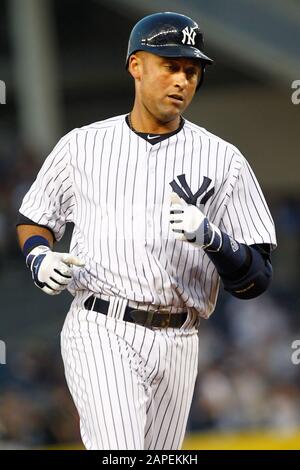 BRONX, NY: New York Yankees shortstop Derek Jeter (2) after hitting a solo homerun against the Minnesota Twins on April 16, 2012 at Yankee Stadium. Stock Photo