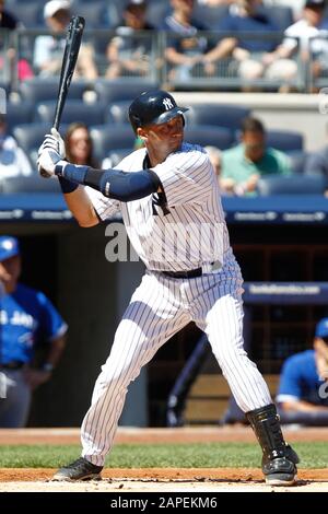 BRONX, NY - AUG 29: New York Yankees shortstop Derek Jeter (2) singles to left against the Toronto Blue Jays on August 29, 2012 at Yankee Stadium. Stock Photo