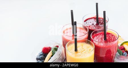 Htalthy fresh fruit and vegetable smoothies with assorted ingredients served in packs. Image with copy space Stock Photo