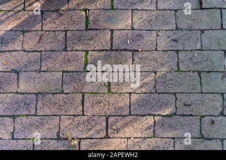 Close up of cobblestones with light and shadow - top view Stock Photo