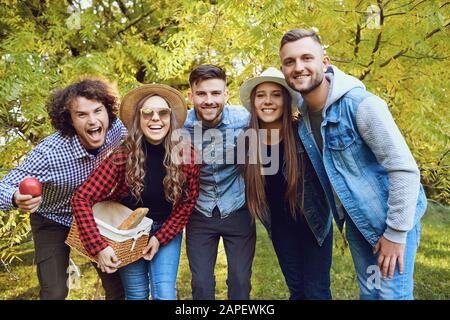 Portrait of a group of cheerful friends in the park. Stock Photo