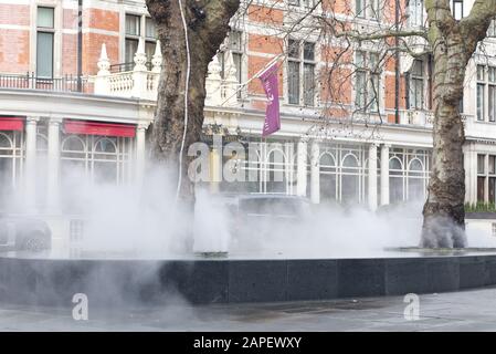 steam rising from the water feature outside the connaught hotel, London Stock Photo
