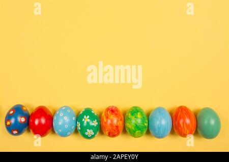 Easter holiday background. Coloured decorated easter eggs on a bright ...