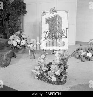 50th anniversary cigar factory Karel I Eindhoven Description: Flower arrangements in baskets and the logo of cigar brand Karel I on an easel (presumably gifts at reception) Date: 1 January 1950 Location: Eindhoven Keywords: flowers, factories, plants, easels, tobacco industry Stock Photo