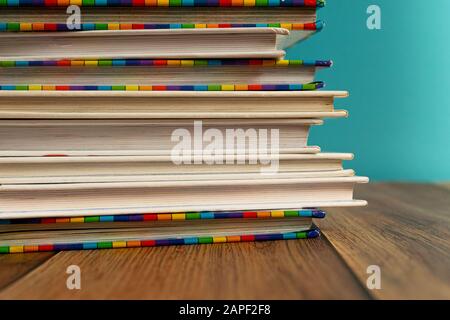 A stack of different bookmarks with bookmarks for pages. Book binding. Knowledge and education. Books for children. School library. Stock Photo