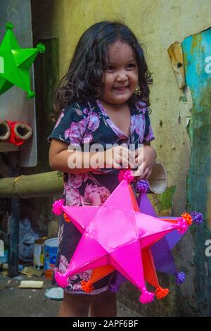 Filipino girl holding a lantern in a Christmas market in Las Pinas city , Manila the Philippines Stock Photo