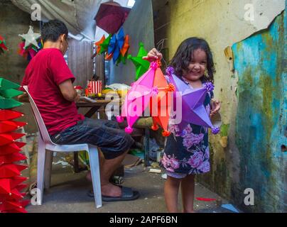 Filipino girl holding a lantern in a Christmas market in Las Pinas city , Manila the Philippines Stock Photo