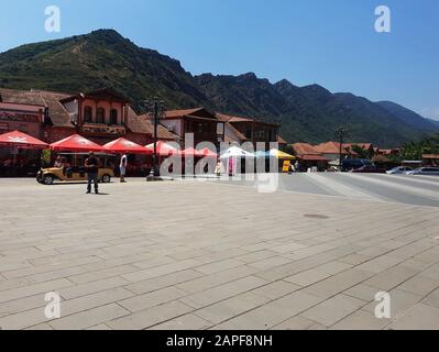 Market stalls with souvenirs for tourists on the street near Svetitskhoveli Cathedral, Mtskheta, Georgia Stock Photo