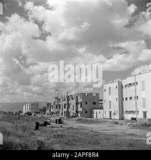 Israel 1948-1949: Haifa Description: Construction site in a new building Date: 1948 Location: Haifa, Israel Keywords: new construction, clouds, homes Stock Photo