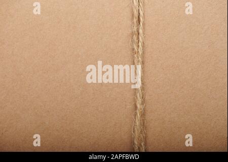 Twine  brown string on paper carton background Stock Photo