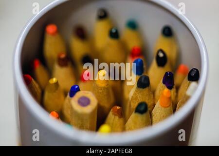 Shallow depth of field (selective focus) and macro image with colored crayons. Stock Photo