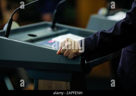 Details with the hand of a politician during a press conference Stock Photo