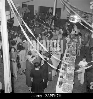 Israel 1948-1949: marriages at Lag BaoMer Description: Wedding guests at a table with dishes, presumably in Haifa Annotation: Lag BaoMer (also Lag Baomer, Lag BaoMer, Lag B'Omer) is a day on which traditional many marriages are concluded Date: 1948 Location: Haifa, Israel Keywords: weddings, marriages, religious holidays, food Stock Photo