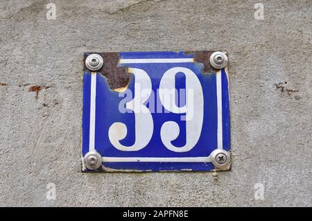A house number plaque, showing the number thirty nine (39) Stock Photo