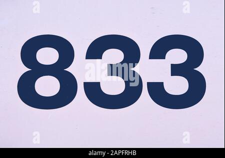 A house number plaque, showing the number one (1) Stock Photo