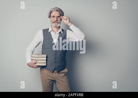 Portrait of confident smart old high school teacher man ready share knowledge on courses touch hands spectacles wear shirt vest brown pants trousers Stock Photo