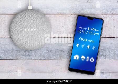 BARCELONA, JAN 23, 2020: Smart home assistant Google Dot controlled with a smart phone app. Stock Photo