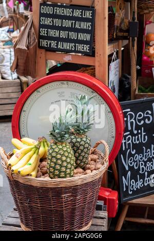 JESRSEY, CHANNEL ISLANDS - JUNE 08, 2019:   Basket of tropical fruit on display in Central Market Stock Photo