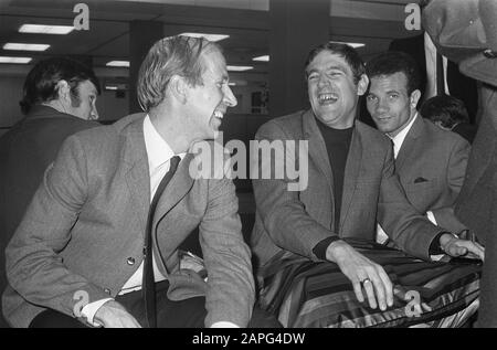 English football team arrives at Schiphol for the match against the Dutch team next Wednesday. Bobby Charlton (left) and right Norman Hunter (Leeds); Stock Photo