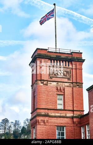 Sir Richard Arkwright’s Masson Mill, a cotton manufacturing mill built in orange red brick in the 18th century beside the River Derwent at Matlock Bat Stock Photo