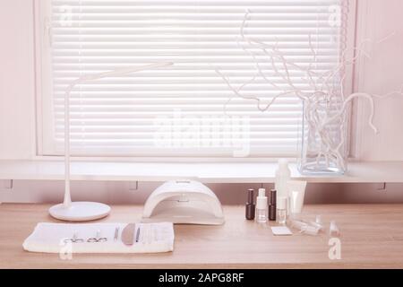 Interior of empty modern nail work place. Work places for masters of manicure Stock Photo