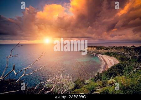 Fantastic view of the overcast sky. Dramatic morning scene. Location: cape Milazzo, nature reserve Piscina di Venere. Island Sicilia, Italy, Europe. Stock Photo