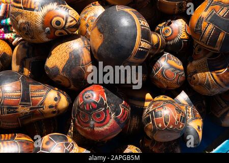 High angle shot of a pile of handcrafted wooden statues of owls Stock Photo