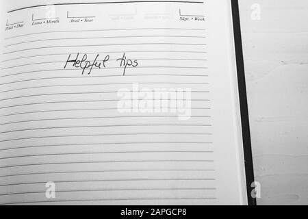 Helpful tips, handwriting text on page of office agenda. Copy space. Stock Photo