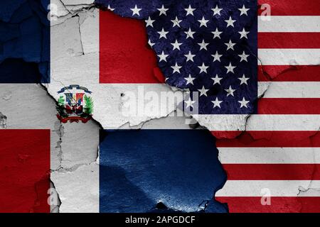 flags of USA and Dominican Republic painted on cracked wall Stock Photo