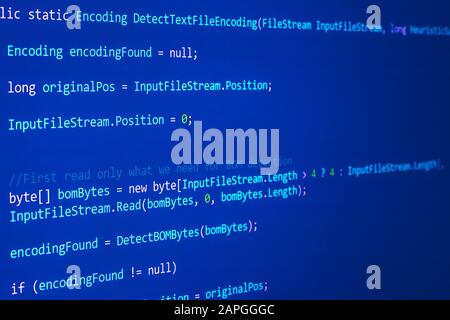 Abstract dark blue background with binary code, programming concept. Technical pattern with symbols software Stock Photo