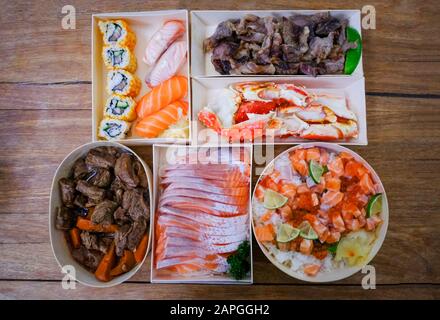Japanese food sushi roll rice with salad salmon sashimi braised beef crab legs in the restaurant sushi menu set / Japanese cuisine fresh ingredients m Stock Photo