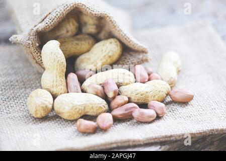 Roasted peanuts on sack background / Peanut in shells for food or snack Stock Photo
